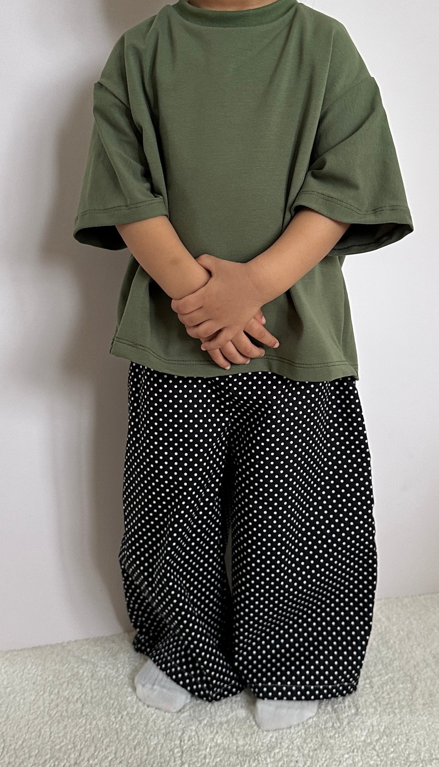 Black polka dot trousers