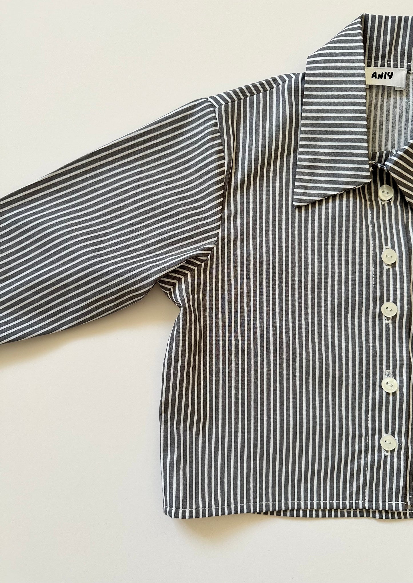 Aniy grey striped shirt